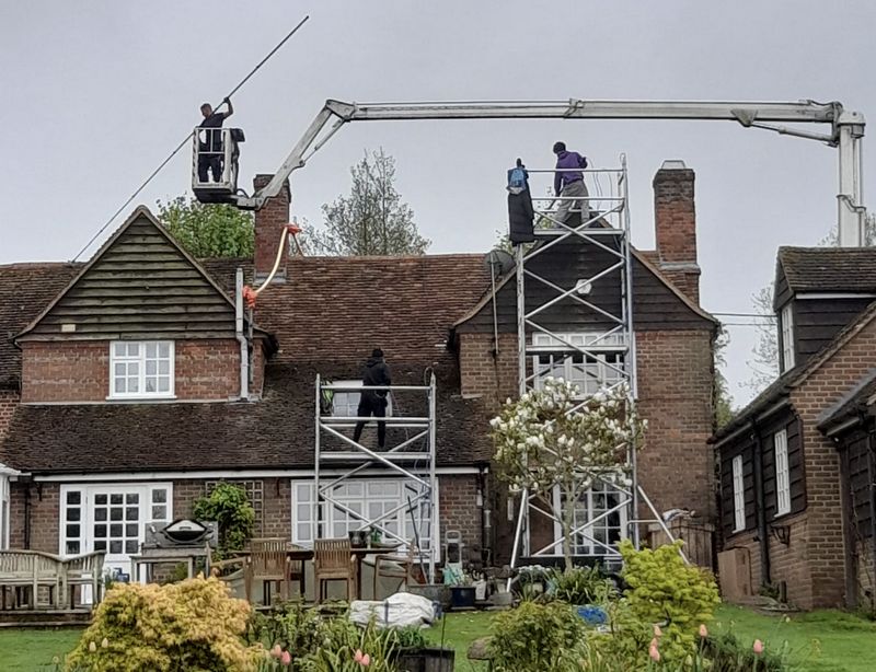The Moss Cleaners using cherry picker and scaffolding to clean roof safely and professionally in Box, Wiltshire